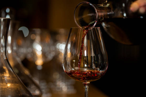 The red wine was poured from the decanter into a crystal glass