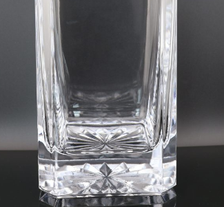 Close-up of a premium whiskey glass decanter punt base