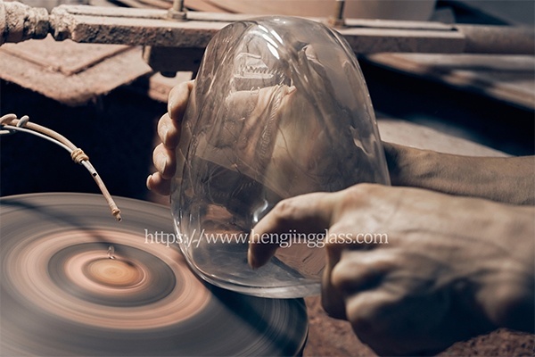 Glass bottle surface finishing and decoration - manual polishing and detail inspection